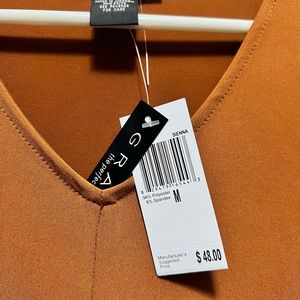 Brand new quarter sleeve silky blouse.